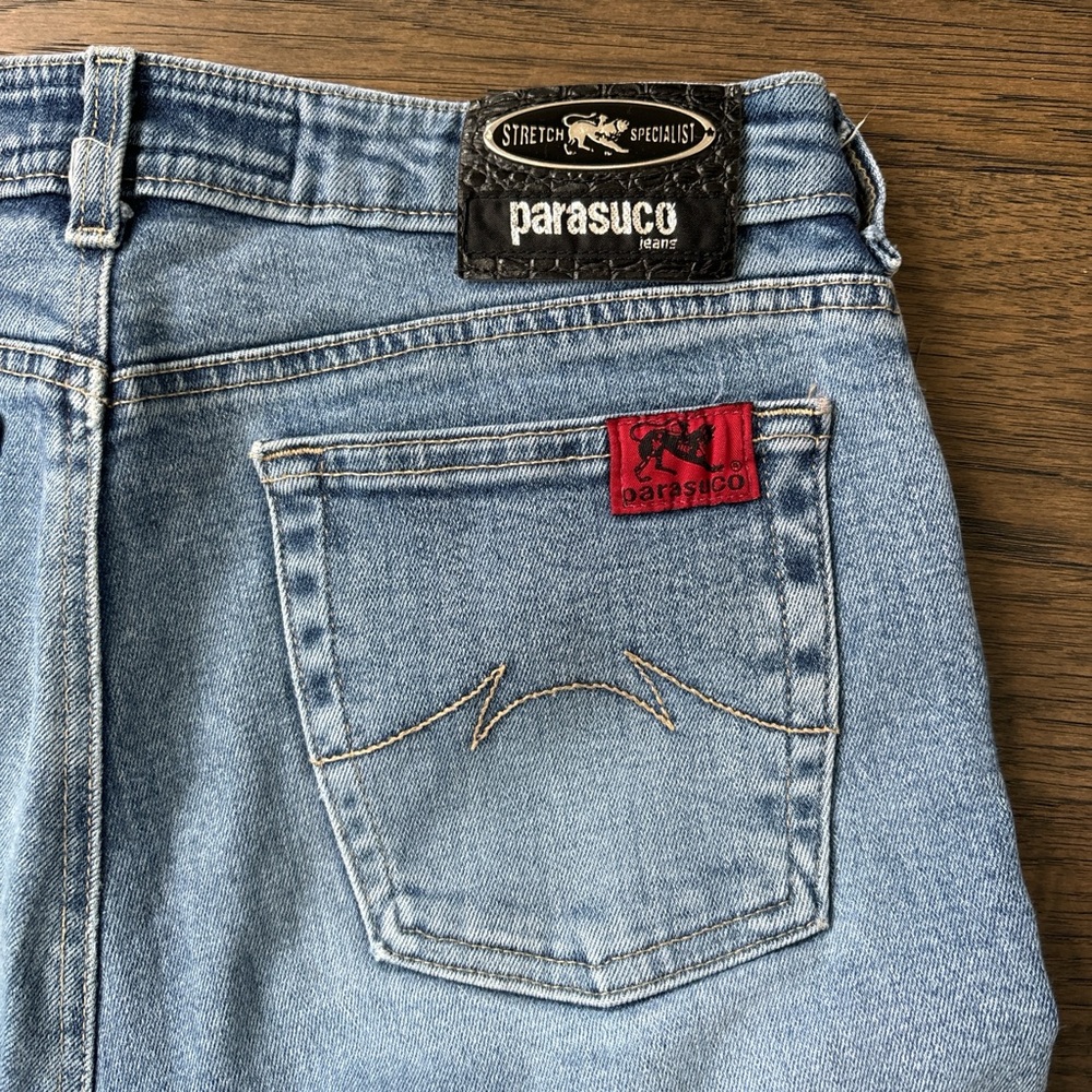 Vintage blue Parasuco jeans with red accents